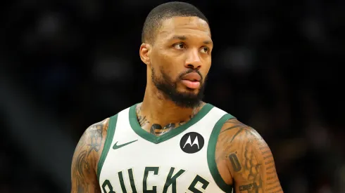 Damian Lillard #0 of the Milwaukee Bucks walks backcourt during a preseason game against the Los Angeles Lakers
