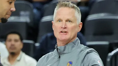 Head coach Steve Kerr of the Golden State Warriors talks with Trayce Jackson-Davis #32 during a break in the first quarter of a preseason game against the Los Angeles Lakers at T-Mobile Arena at T-Mobile Arena on October 15, 2024 in Las Vegas, Nevada. The Warriors defeated the Lakers 111-97. 
