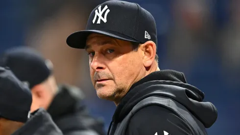 Manager Aaron Boone #17 of the New York Yankees during batting practice before Game Four of the American League Championship Series against the Cleveland Guardians at Progressive Field on October 18, 2024 in Cleveland, Ohio.
