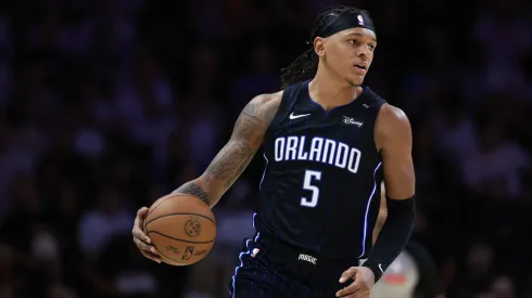 Paolo Banchero #5 of the Orlando Magic controls the ball against the Miami Heat during the second half at Kaseya Center on October 23, 2024 in Miami, Florida.
