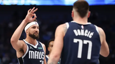 Klay Thompson #31 of the Dallas Mavericks congratulates Luka Doncic #77 on his three-point basket against the San Antonio Spurs during the third quarter at American Airlines Center