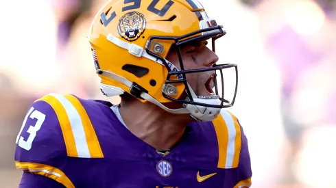 Garrett Nussmeier #13 of the LSU Tigers reacts after throwing a touchdown pass during the fourth quarter of an NCAA football game against the UCLA Bruins at Tiger Stadium on September 21, 2024 in Baton Rouge, Louisiana.
