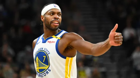 Buddy Hield #7 of the Golden State Warriors motions to a teammate during the second half of a game against the Utah Jazz
