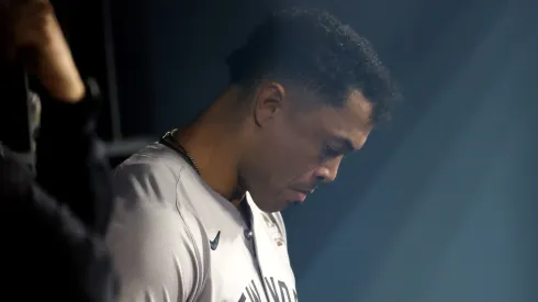 Giancarlo Stanton #27 of the New York Yankees looks on from the dugout as they play the Los Angeles Dodgers in the eighth inning during Game Two of the 2024 World Series at Dodger Stadium on October 26, 2024 in Los Angeles, California.
