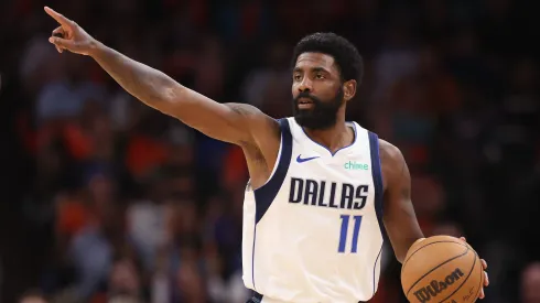 Kyrie Irving #11 of the Dallas Mavericks handles the ball during the NBA game at Footprint Center