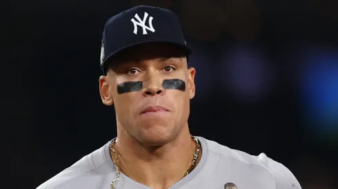 Aaron Judge #99 of the New York Yankees jog off the field at the end of the ninth inning during Game One of the 2024 World Series at Dodger Stadium on October 25, 2024 in Los Angeles, California.
