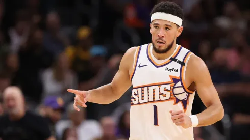 Devin Booker #1 of the Phoenix Suns reacts after scoring against the Los Angeles Lakers
