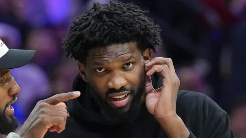 Paul George #8 of the Philadelphia 76ers talks to Joel Embiid #21 during a timeout in the game against the Memphis Grizzlies in the first half at the Wells Fargo Center on November 2, 2024 in Philadelphia, Pennsylvania. 
