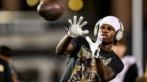 Travis Hunter #12 of the Colorado Buffaloes warms up before a game against the Cincinnati Bearcats at Folsom Field on October 26, 2024 in Boulder, Colorado.
