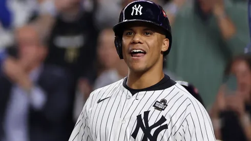 Juan Soto #22 of the New York Yankees waits to congratulate Aaron Judge #99 after Judge hit a two-run home run during the first inning of Game Five of the 2024 World Series against the Los Angeles Dodgers at Yankee Stadium on October 30, 2024 in the Bronx borough of New York City. 
