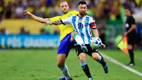 Lionel Messi of Argentina and Carlos Augusto of Brazil battle for the ball during a FIFA World Cup 2026 Qualifier match between Brazil and Argentina at Maracana Stadium on November 21, 2023 in Rio de Janeiro, Brazil.
