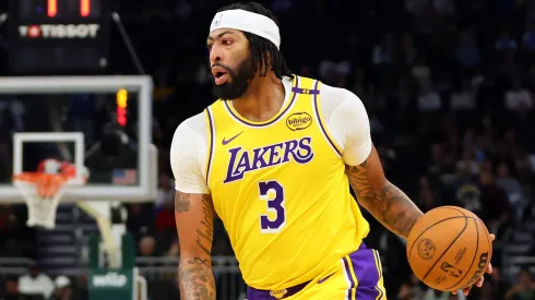 Anthony Davis #3 of the Los Angeles Lakers handles the ball during a preseason game against the Milwaukee Bucks
