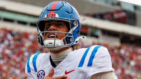 Jaxson Dart #2 of the Ole Miss Rebels celebrates after throwing a touchdown pass in the second half during a game against the Arkansas Razorbacks at Donald W. Reynolds Razorback Stadium on November 02, 2024 in Fayetteville, Arkansas. The Rebels defeated the Razorbacks 63-31.
