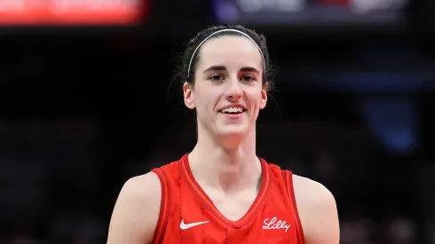 Caitlin Clark #22 of the Indiana Fever smiles against the Chicago Sky 
