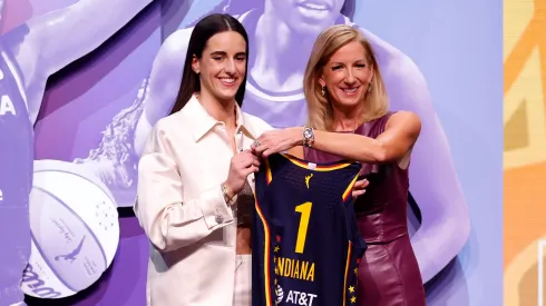 Caitlin Clark poses with WNBA Commissioner Cathy Engelbert after being selected first overall pick by the Indiana Fever
