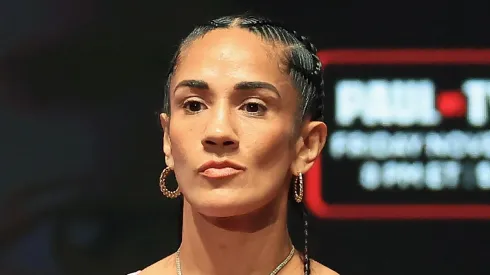 Amanda Serrano poses on the scale during her ceremonial weigh-in at The Pavilion at Toyota Music Factory on November 14, 2024 in Irving, Texas. Serrano is scheduled to challenge undisputed super lightweight champion Katie Taylor for her title on November 15 at AT&T Stadium in Arlington, Texas.