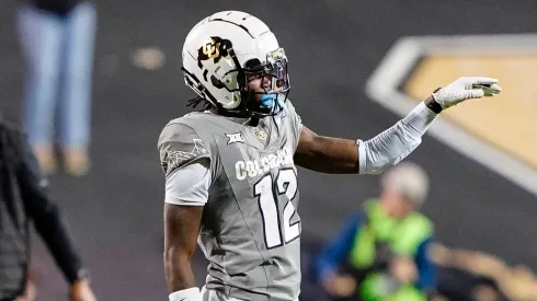 Colorado Buffaloes wide receiver Travis Hunter (12) flips the ball away after making a long catch while being interfered with in the second half of the football game between Colorado and Cincinnati in Boulder, CO.
