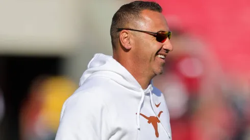  Longhorns Head Coach Steve Sarkisian makes his way across the field. Texas defeated Arkansas 20-10 in Fayetteville, AR.
