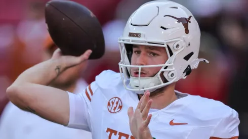 Quinn Ewers 3 Texas quarterback works to loosen his arm. Texas defeated Arkansas 20-10 in Fayetteville, AR.
