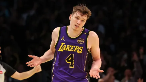 Dalton Knecht #4 of the Los Angeles Lakers reacts after scoring his fourth consecutive 3-point basket against the Utah Jazz during the third quarter of the Emirates NBA Cup at Crypto.com Arena on November 19, 2024 in Los Angeles, California.
