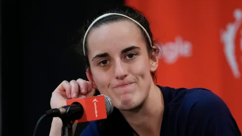 Caitlin Clark #22 of the Indiana Fever looks on during a press conference after losing 81-87 to the Connecticut Sun
