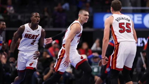 Tyler Herro #14 of the Miami Heat reacts to a three point basket late in regulation to tie the game against the Detroit Pistons with Terry Rozier #2 and Duncan Robinson #55 in the first round of the Emirates NBA Cup at Little Caesars Arena on November 12, 2024 in Detroit, Michigan. 
