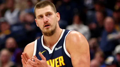 Nikola Jokic #15 of the Denver Nuggets applauds a play against the Oklahoma City Thunder in the first quarter at Ball Arena
