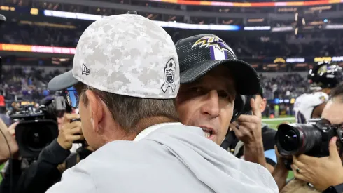 Head coach John Harbaugh (R) of the Baltimore Ravens hugs his brother head coach Jim Harbaugh (L) of the Los Angeles Chargers after the game at SoFi Stadium on November 25, 2024 in Inglewood, California.
