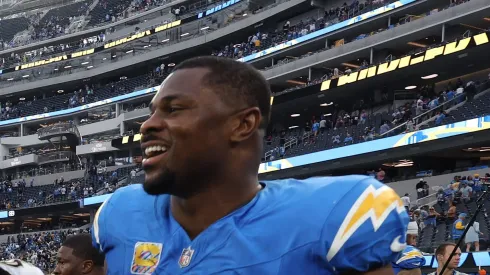 Alvin Kamara #41 of the New Orleans Saints and Khalil Mack #52 of the Los Angeles Chargers talk after Los Angeles' 26-8 win at SoFi Stadium on October 27, 2024 in Inglewood, California.
