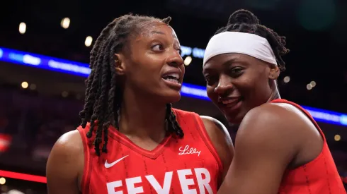 Kelsey Mitchell #0 of the Indiana Fever is held back by Erica Wheeler #17 during the second half against the Phoenix Mercury
