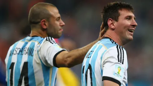 Javier Mascherano and Lionel Messi of Argentina celebrate victory over the Netherlands in a penalty shootout during the 2014 FIFA World Cup Brazil Semi Final match between the Netherlands and Argentina at Arena de Sao Paulo on July 9, 2014 in Sao Paulo, Brazil.