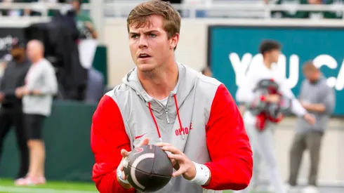 Ohio State quarterback WILL HOWARD (18) warms up before Ohio State s game against Michigan State at Spartan Stadium.
