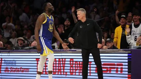Draymond Green #23 of the Golden State Warriors high fives head coach Steve Kerr during the fourth quarter against the Los Angeles Lakers in game six of the Western Conference Semifinal Playoffs at Crypto.com Arena on May 12, 2023 in Los Angeles, California.
