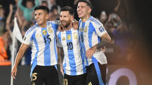 Lionel Messi of Argentina celebrates his third goal of the night with Thiago Almada and Enzo Fernandez during a match between Argentina and Bolivia
