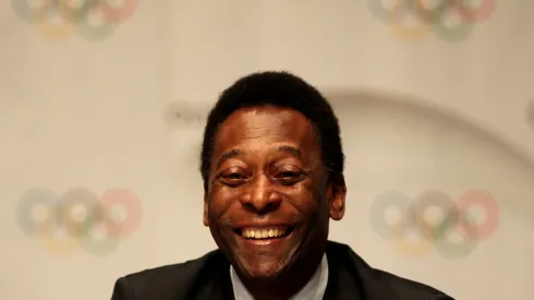 Brazilian soccer legend Pele smiles during a press conference after the Rio 2016 presentation