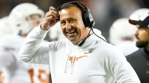 Texas head coach Steve Sarkisian smiles after a play during the first half of the college football game between the Texas A&M Aggies and the Texas Longhorns on November 30, 2024.
