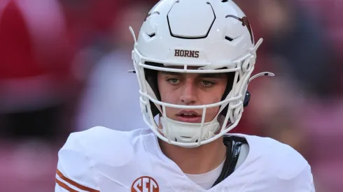 Arch Manning 16 Longhorn QB takes a snap from his center. Texas defeated Arkansas 20-10 in Fayetteville, AR.
