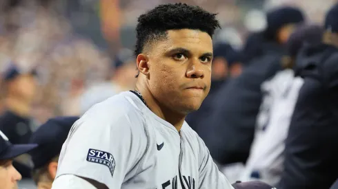 Juan Soto 22 of the New York Yankees is watching the action from the dugout during the sixth inning of the baseball game against the New York Mets.
