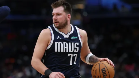 Luka Doncic #77 of the Dallas Mavericks dribbles the ball against the Washington Wizards at Capital One Arena
