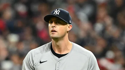 Clay Holmes #35 of the New York Yankees reacts after allowing a run in the seventh inning against the Cleveland Guardians during Game Four of the American League Championship Series at Progressive Field on October 18, 2024 in Cleveland, Ohio.
