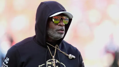 Head coach Deion Sanders of the Colorado Buffaloes watches his team warm up prior to a game against the Kansas Jayhawks at Arrowhead Stadium on November 23, 2024 in Kansas City, Missouri.
