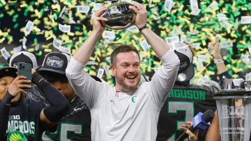 Big Ten Championship Penn State vs Oregon DEC 07 December 7, 2024: Oregon Ducks head coach Dan Lanning celebrates with the trophy after the NCAA Big Ten Championship football game between the Penn State Nittany Lions and the Oregon Ducks at Lucas Oil Stadium in Indianapolis, Indiana. Darren Lee CSM.
