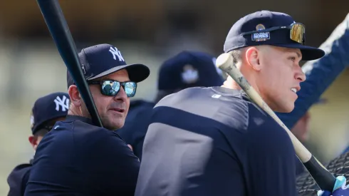 Aaron Boone #17 and Aaron Judge #99 of the New York Yankees look on during batting practice ahead of Game Two of the 2024 World Series between the Los Angeles Dodgers and the New York Yankees at Dodger Stadium on October 26, 2024 in Los Angeles, California.