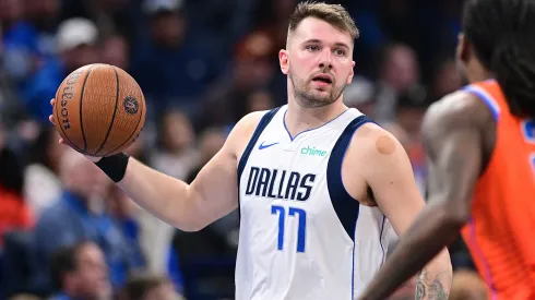 Luka Doncic #77 of the Dallas Mavericks handles the ball in front of Cason Wallace #22 of the Oklahoma City Thunder during the second half at Paycom Center.
