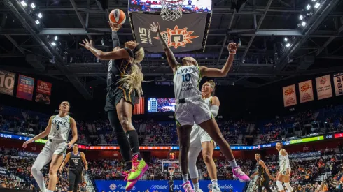 Connecticut Sun guard forward DiJonai Carrington (21) shoots a reverse layup during game 3 of the semifinals of the WNBA playoffs between the Minnesota Lynx and the Connecticut Sun on October 4, 2024.
