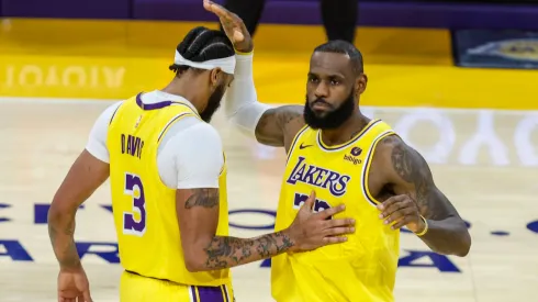 Los Angeles Lakers Anthony Davis 3 is greeted by LeBron James 23 after scoring against the Orlando Magic.
