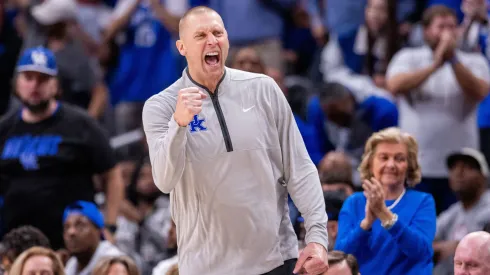 Head coach Dan Hurley of the Connecticut Huskies celebrates with his team during the trophy ceremony after beating the Purdue Boilermakers 75-60 to win the NCAA Men's Basketball Tournament National Championship game at State Farm Stadium on April 08, 2024 in Glendale, Arizona.