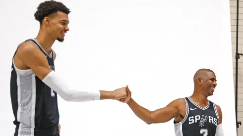 Victor Wembanyama #1 of the San Antonio Spurs and Chris Paul #3 prepare to have their photograph taken at the San Antonio Spurs Media Day at the Victory Capital Performance Center on September 30, 2024 in San Antonio, Texas.