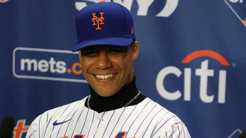 Juan Soto of the New York Mets sits at the das with his agent Scott Boras during his introductory press conference at Citi Field on December 12, 2024 in New York City.