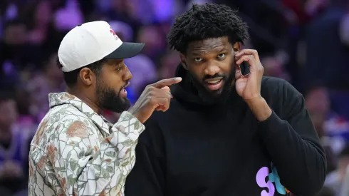 Paul George #8 of the Philadelphia 76ers talks to Joel Embiid #21 during a timeout in the game against the Memphis Grizzlies.
